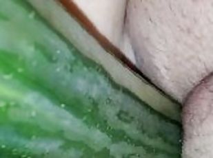 Masturbating with a cucumber