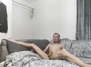 Very skinny lad Stokes his juicy cock on his bed until he shoots out cum