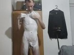 Very skinny teen applies shaving cream on his body and his cock