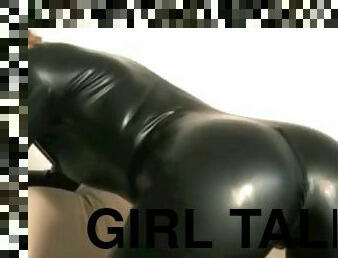 Girl talking in a catsuit