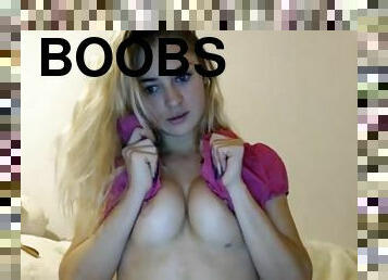 Cute blond girl is showing her big boobs