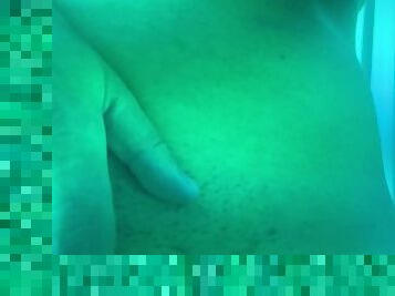 Girl fingers her pussy and spreads her pussy in tanning bed