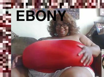 Ebony granny plays with her huge boobs