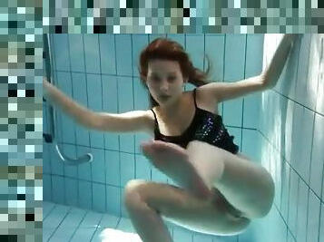 Sheer pantyhose are all wet on girl in pool