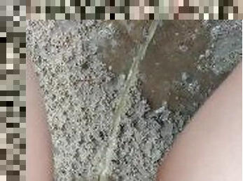 Massive Pee to the wet sand and make a puddle [Close up]