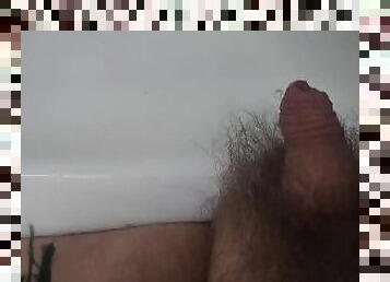 Dirty boy pissing in the sink