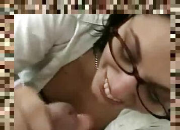 Sexy chick in glasses is sucking a big dick