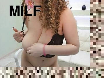 Girl with curly hair and huge tits plays with pussy