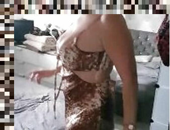 Jess waiting in snake print dress