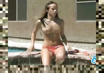 Teen takes off her bikini in the hot tub