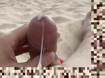 Relax on a nudist beach away from people. Handjob and cumshot in public