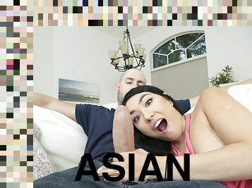 Horny Asian girl pleasuring Duncan in the living room