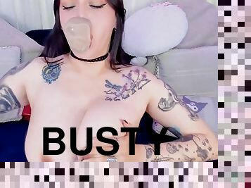 Busty tattooed babe sucks her dildo like a real cock