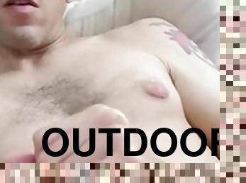 Jerks off his dick outdoors in the car