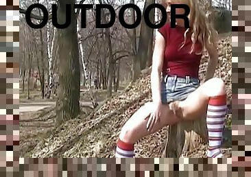 Sexy outdoor solo scene with long-haired blonde