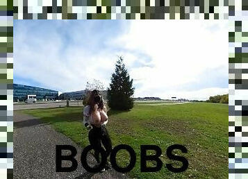 Crossdresser flashing boobs by the side of a busy highway