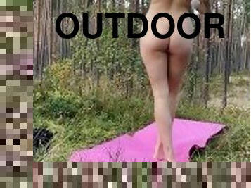 Nude yoga in forest