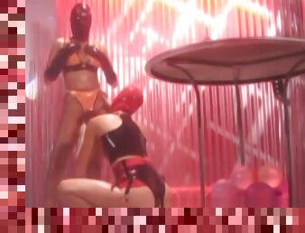 Masked latex subs toyed with by lesbian dominatrix