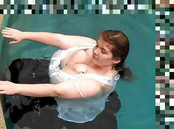 Huge babe goes swimming fully clothed