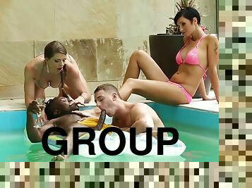 Group of friends has fun in the pool