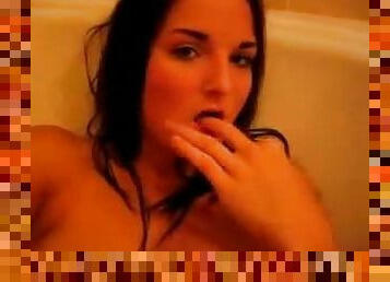 Brunette in bathroom finger fucks vagina