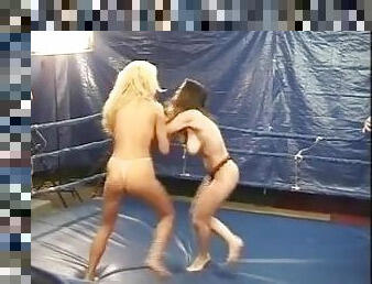 catfight Topless female boxing as blonde battles brunette with body punches, kidney punches an