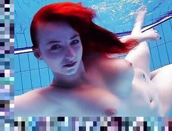 Big tits Katrin bouncing and floating underwater