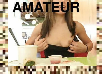 Horny teen shows her tits and pussy in a diner