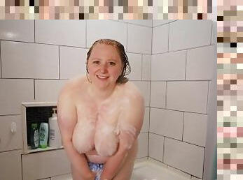 BBW redhead enjoying a hot shower
