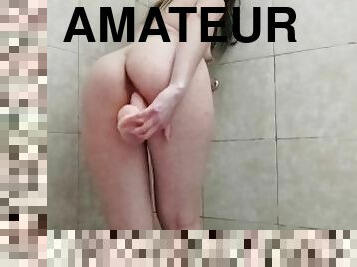Amateur plays before taking a shower with a new dildo cock
