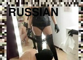 Two Russian mistresses play with the slave's cock
