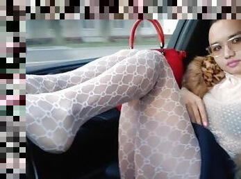 Bimbo-girl doll dancing in the car and showing her sexy feet and oot