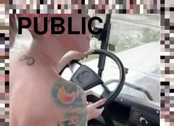 Driving golf cart through town fully nude