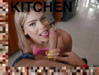 Gentle blonde plays with a big cock on the kitchen floor