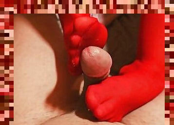 Girl gives Footjob in red stockings