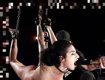 Darkhaired in chains gagged with dildo