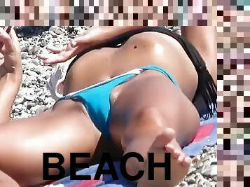 A pervert with a camera comes to the beach to shoot hot girls