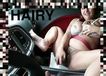 Bosomy hairy girl masturbates in the car