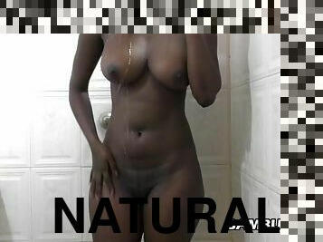 Natural ebony boops shaved pussy taking a shower