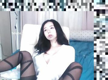 Stunning asian masturbates in black stockings