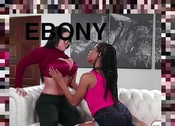 Ebony licks and fucks busty brunette using her big strap on