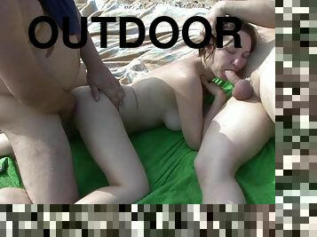 Cock sucking slut in outdoor trio