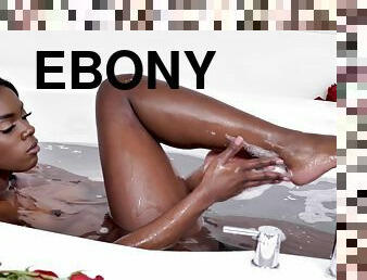 Ebony beauty showers her sensible pussy and clit