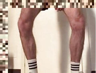 hairy guy in sneakers and white socks jerks off and shows his legs