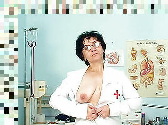 Mature nurse in glasses toys pussy
