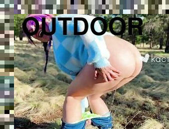 colorful kutie pees outdoors