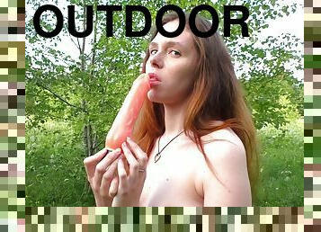 Young ginger slut plays with her dildo in perfect outdoor solo