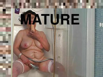 Chubby mature toy fucks her fat cunt in home alone shower scenes