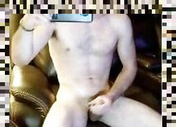 Sexy young stud watching porn while home alone. Big cumshot