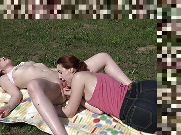 Lovely lesbian romance on the grass for two teens